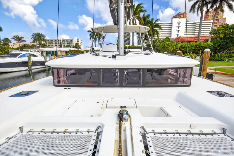  Yacht Photos Pics 2019 Lagoon 450 F catamaran docked, showcasing spacious deck and modern design.