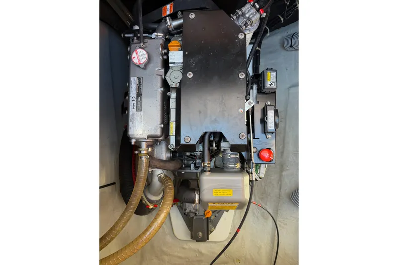  Yacht Photos Pics Engine compartment of a 2019 Lagoon 450 F catamaran, showcasing mechanical components and hoses.