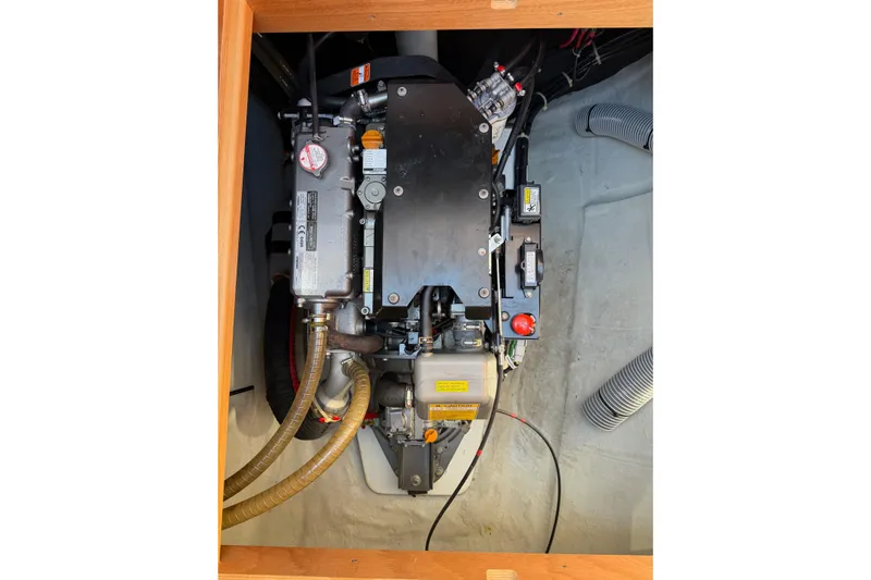  Yacht Photos Pics Engine compartment of a 2019 Lagoon 450 F catamaran, showcasing mechanical components.