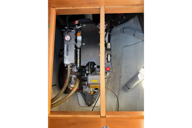  Yacht Photos Pics Engine compartment of a 2019 Lagoon 450 F catamaran, showcasing mechanical components.