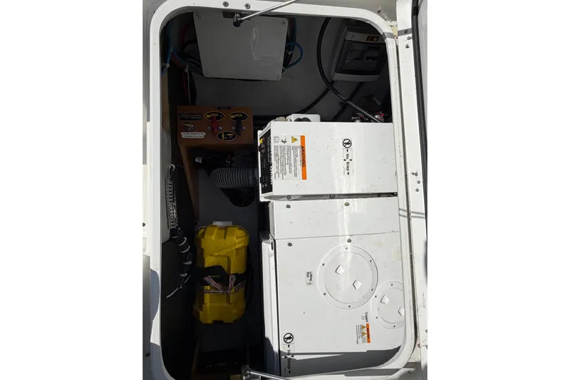  Yacht Photos Pics Engine compartment of 2019 Lagoon 450 F catamaran, showing mechanical components and wiring.