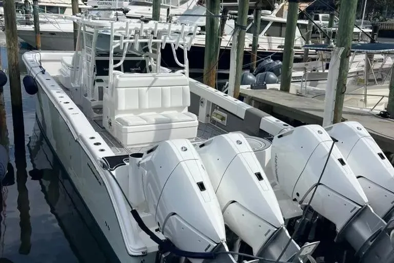  Yacht Photos Pics 2020 Invincible 40 Catamaran with quad engines docked at marina.