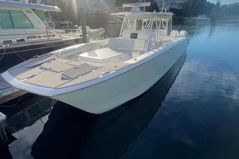  Yacht Photos Pics 2020 Invincible 40 Catamaran docked in calm marina waters.