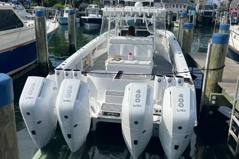  Yacht Photos Pics 2020 Invincible 40 Catamaran with quad 400 V10 engines docked at marina.