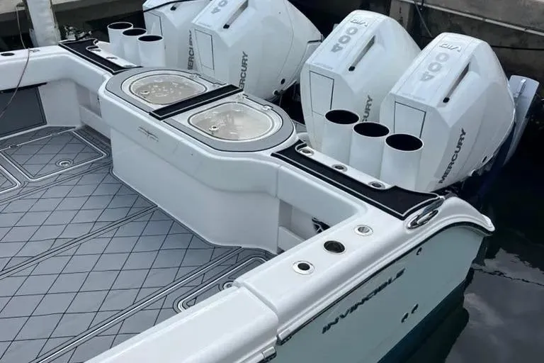  Yacht Photos Pics 2020 Invincible 40 Catamaran with Mercury outboard engines, docked at marina.