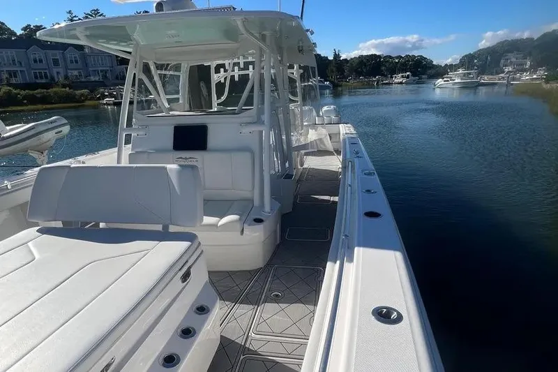  Yacht Photos Pics 2020 Invincible 40 Catamaran on calm water, featuring spacious deck and modern design.