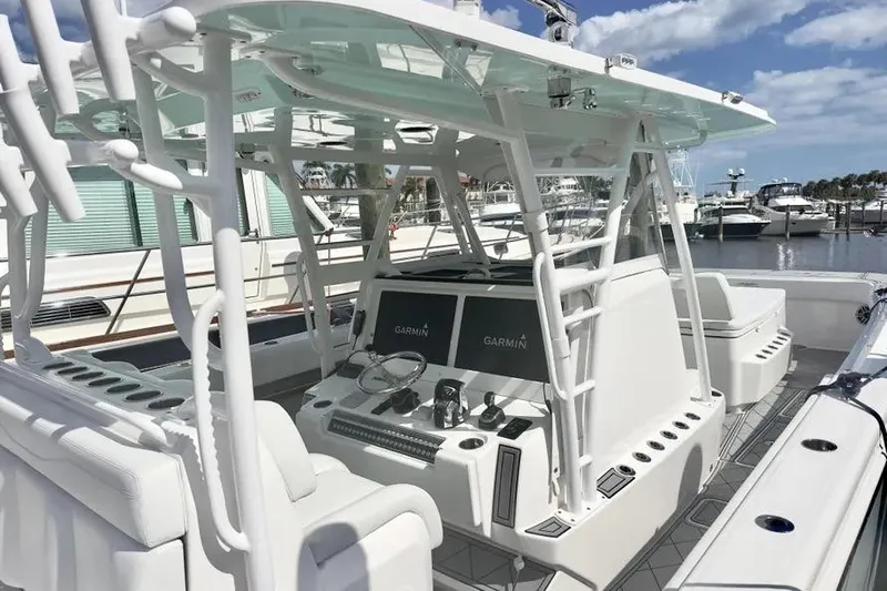  Yacht Photos Pics 2020 Invincible 40 Catamaran interior with advanced Garmin navigation system at marina.