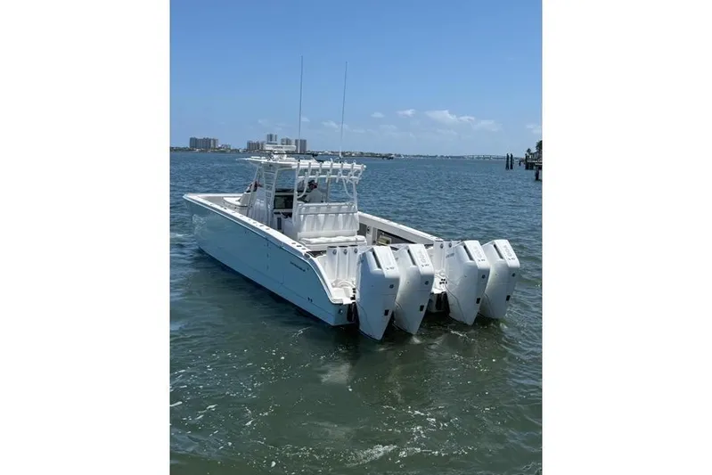  Yacht Photos Pics 2020 Invincible 40 Catamaran with multiple outboard engines on the water.