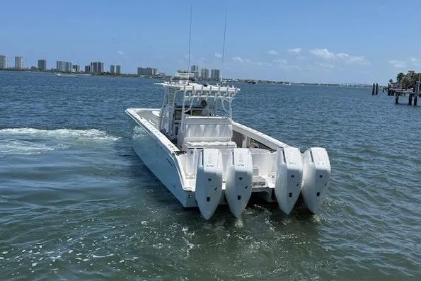  Yacht Photos Pics 2020 Invincible 40 Catamaran with four engines cruising on a sunny day.