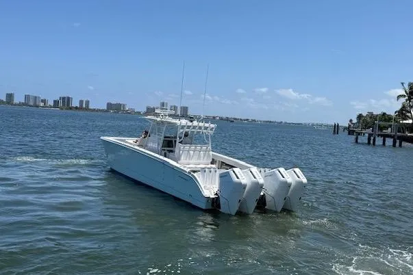  Yacht Photos Pics 2020 Invincible 40 Catamaran with four engines cruising on a sunny day.