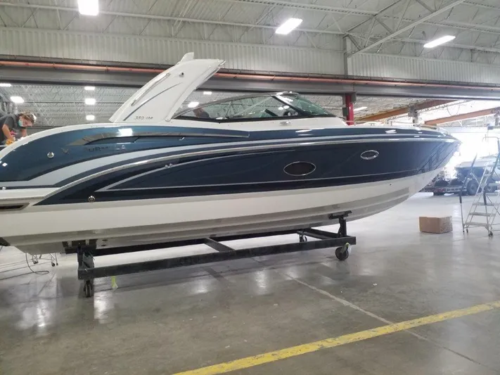 Yacht Photos Pics 2021 Formula 350 Crossover Bowrider in a warehouse, side view.