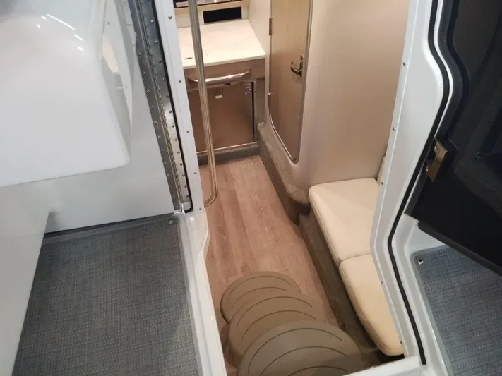  Yacht Photos Pics Interior cabin of 2021 Formula 350 Crossover Bowrider with seating and kitchenette.