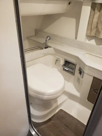  Yacht Photos Pics 2021 Formula 350 Crossover Bowrider bathroom with modern fixtures and white interior.