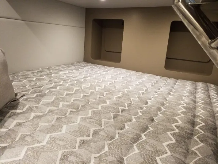  Yacht Photos Pics 2021 Formula 350 Crossover Bowrider cabin bed with patterned bedding.