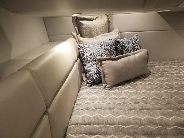  Yacht Photos Pics 2021 Formula 350 Crossover Bowrider cabin with plush bedding and decorative pillows.