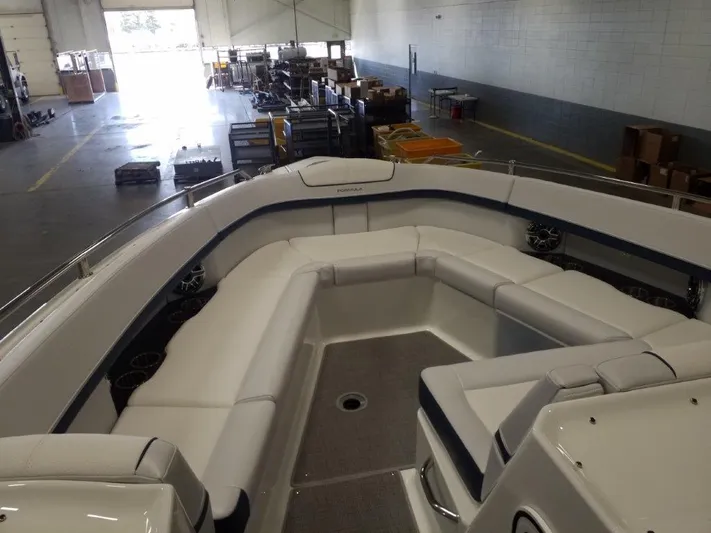  Yacht Photos Pics 2021 Formula 350 Crossover Bowrider interior with spacious seating in a warehouse.