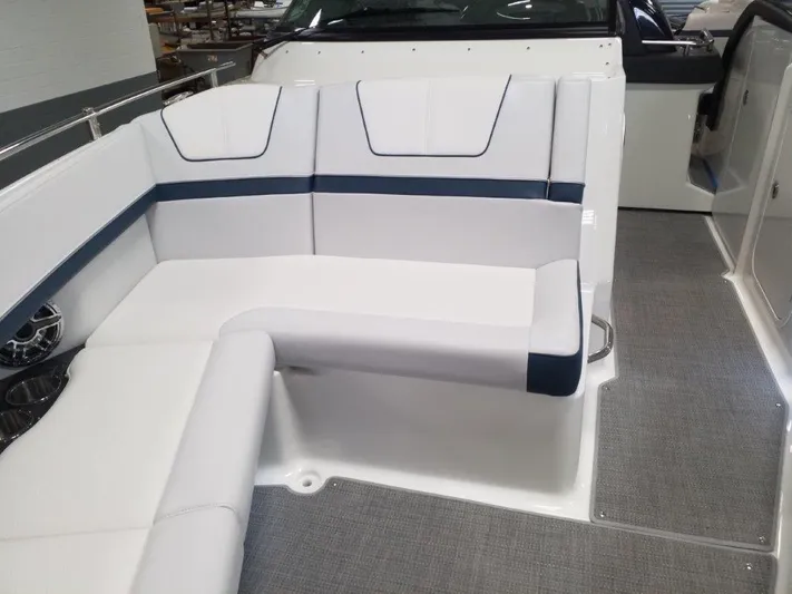  Yacht Photos Pics 2021 Formula 350 Crossover Bowrider interior seating area with white and blue upholstery.