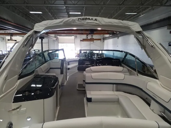 Yacht Photos Pics 2021 Formula 350 Crossover Bowrider interior view in a showroom.
