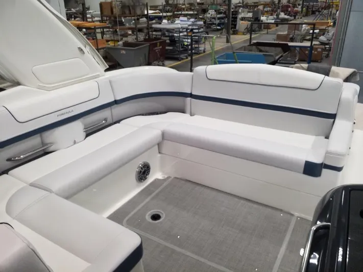  Yacht Photos Pics 2021 Formula 350 Crossover Bowrider interior seating area in a factory setting.
