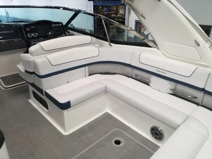  Yacht Photos Pics 2021 Formula 350 Crossover Bowrider interior with white and blue seating.