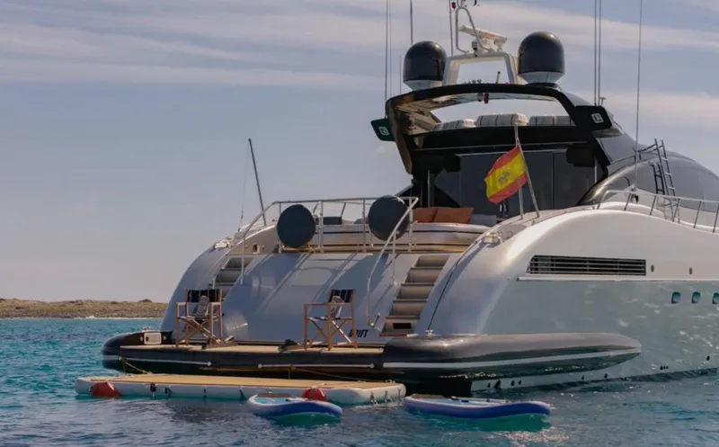 Drift Yacht Photos Pics Luxury 2005 Mangusta 92 yacht anchored, featuring a spacious deck and water sports equipment.