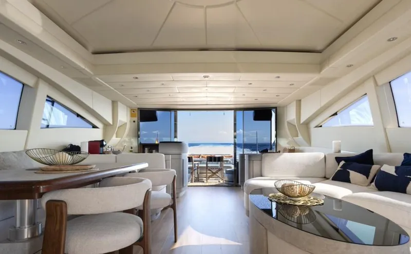 Drift Yacht Photos Pics Luxurious interior of 2005 Mangusta 92 yacht with elegant seating and ocean view.
