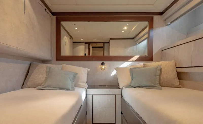 Drift Yacht Photos Pics Luxurious twin cabin interior of 2005 Mangusta 92 yacht with elegant decor and soft lighting.