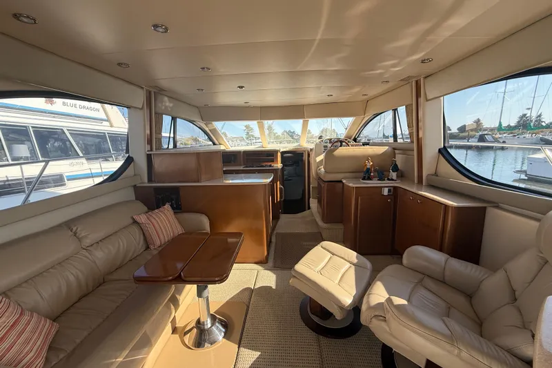 Her Idea Yacht Photos Pics Luxurious interior of a 2005 Meridian 381 yacht with plush seating and elegant wood finishes.