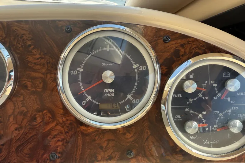 Her Idea Yacht Photos Pics Dashboard gauges of a 2005 Meridian 381 boat, featuring RPM and fuel indicators.