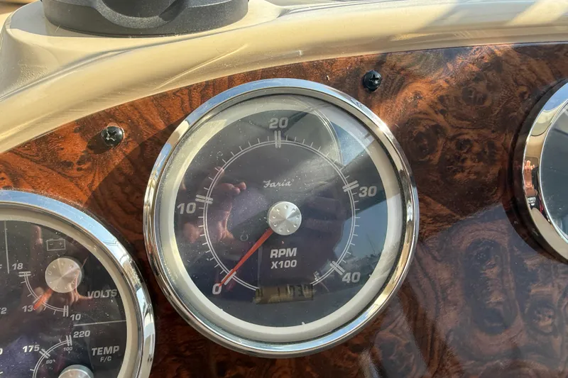 Her Idea Yacht Photos Pics Close-up of a 2005 Meridian 381 boat dashboard with RPM gauge.