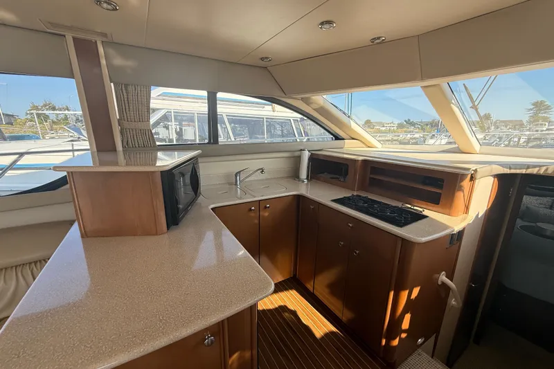 Her Idea Yacht Photos Pics Luxurious 2005 Meridian 381 yacht interior with modern kitchen and panoramic windows.