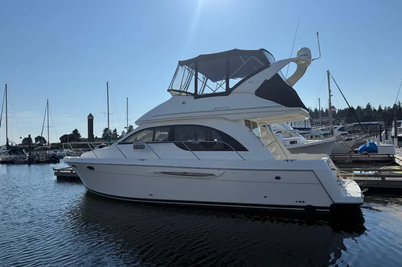 Her Idea Yacht Photos Pics 2005 Meridian 381 yacht docked at marina under clear blue sky.