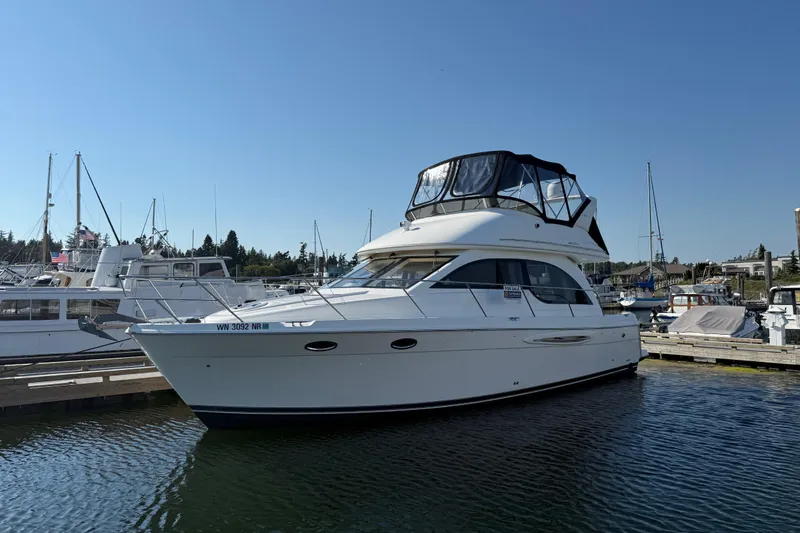 Her Idea Yacht Photos Pics 2005 Meridian 381 yacht docked at marina under clear blue sky.