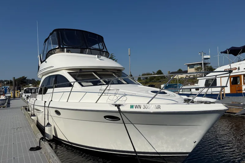 Her Idea Yacht Photos Pics 2005 Meridian 381 yacht docked at marina under clear blue sky.