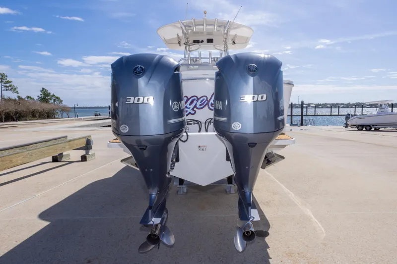 Change Order Yacht Photos Pics 2018 Regulator 31 boat with dual Yamaha 300 engines at a marina dock.