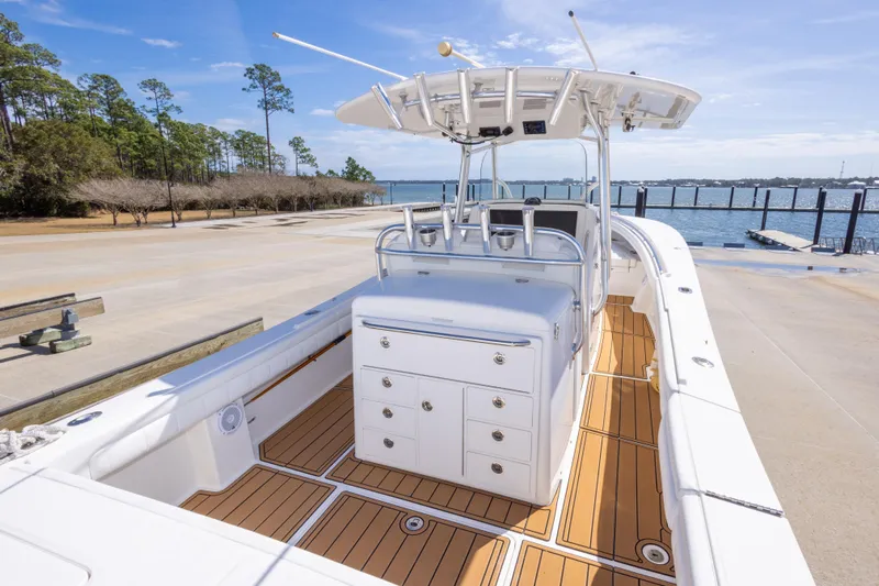 Change Order Yacht Photos Pics 2018 Regulator 31 boat with sleek design, spacious deck, and modern amenities by the water.