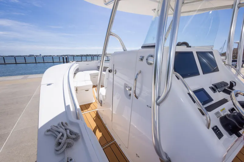Change Order Yacht Photos Pics 2018 Regulator 31 boat cockpit with modern controls and ocean view.