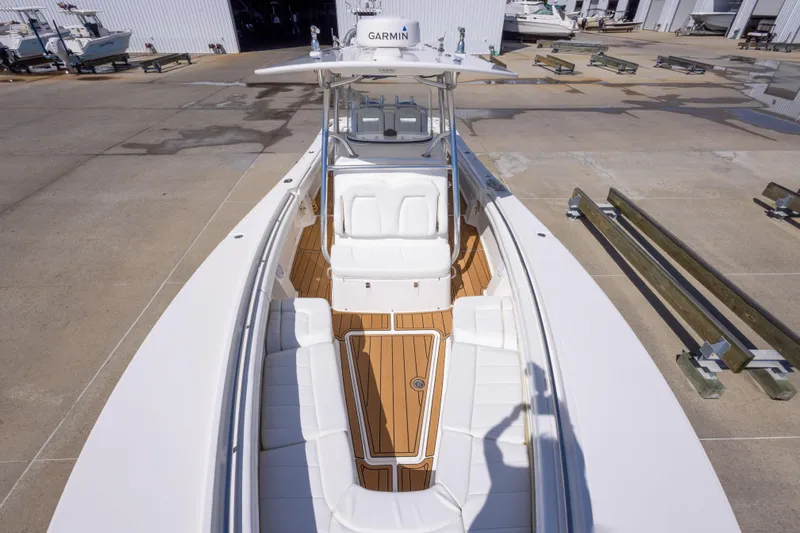 Change Order Yacht Photos Pics 2018 Regulator 31 boat with teak deck, docked at a marina.