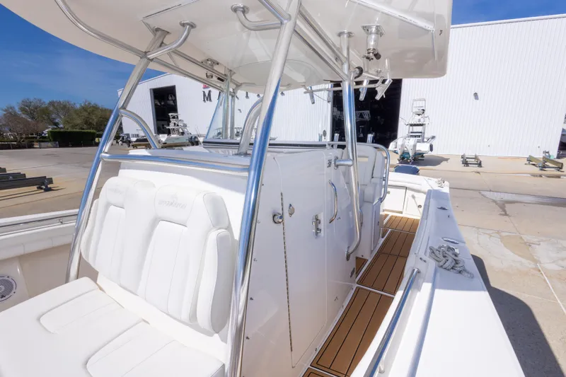 Change Order Yacht Photos Pics 2018 Regulator 31 boat interior with white seating and stainless steel railings.