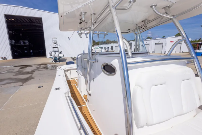 Change Order Yacht Photos Pics 2018 Regulator 31 boat at marina, showcasing sleek design and spacious deck.