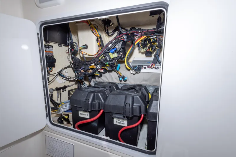 Change Order Yacht Photos Pics Electrical compartment of a 2018 Regulator 31 boat, featuring batteries and wiring.