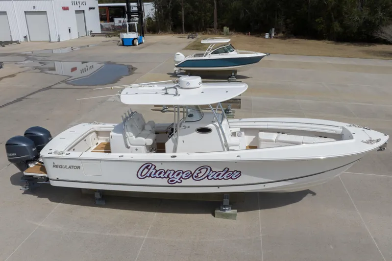 Change Order Yacht Photos Pics 2018 Regulator 31 boat on display with "Change Order" name, dual Yamaha engines.