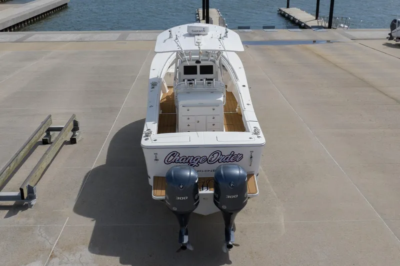 Change Order Yacht Photos Pics 2018 Regulator 31 boat with twin 300 engines docked near water.