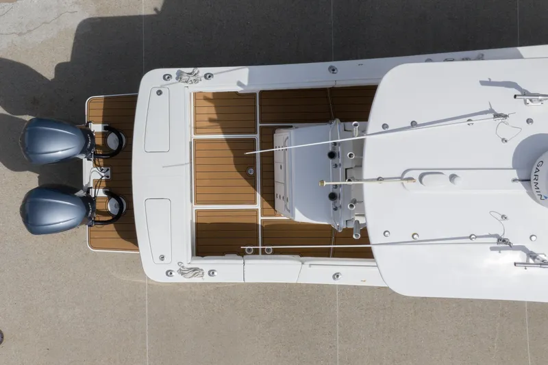 Change Order Yacht Photos Pics Aerial view of 2018 Regulator 31 boat with twin engines and wooden deck.