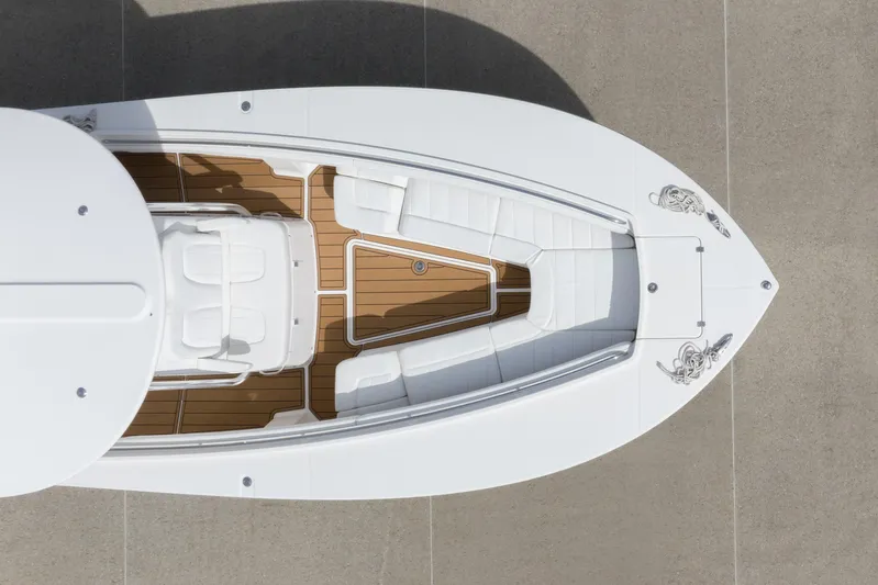 Change Order Yacht Photos Pics Overhead view of 2018 Regulator 31 boat with white seating and wooden deck.