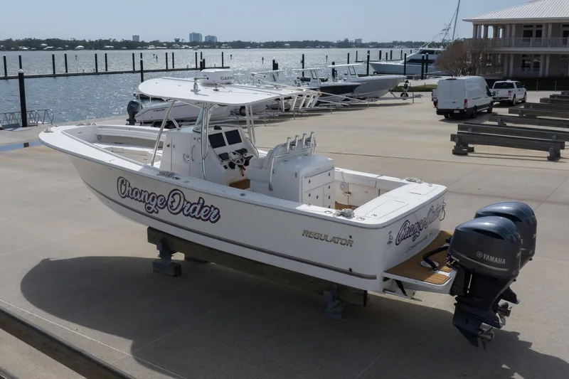 Change Order Yacht Photos Pics 2018 Regulator 31 boat with Yamaha engines docked by the waterfront.
