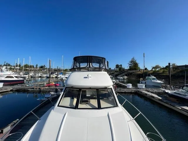 Her Idea Yacht Photos Pics 2005 Meridian 381 yacht docked at a marina under clear blue sky.
