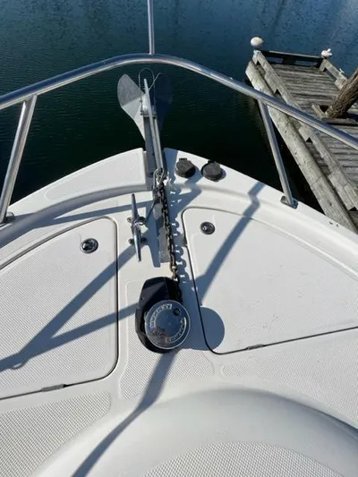 Her Idea Yacht Photos Pics 2005 Meridian 381 boat anchor and chain on deck near dock.