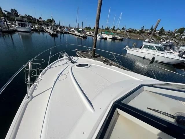 Her Idea Yacht Photos Pics 2005 Meridian 381 yacht docked in a marina on a sunny day.