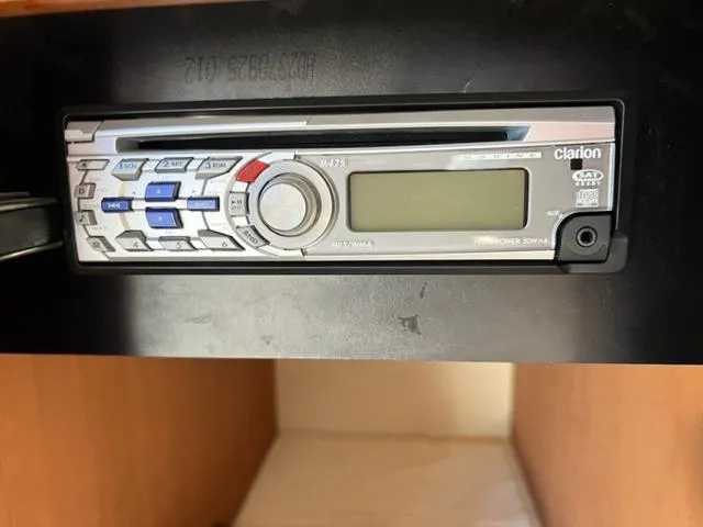 Her Idea Yacht Photos Pics 2005 Meridian 381 boat stereo system, Clarion M475 model, installed in a wooden cabinet.